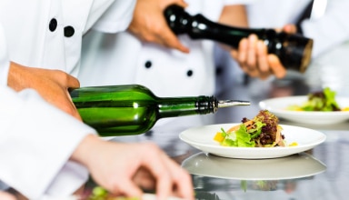 Asian Chef In Restaurant Kitchen Cooking