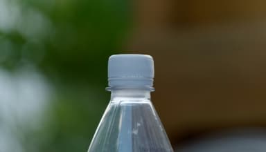 a close up of a water bottle with a blurry background