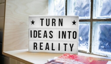 white and black wooden quote board