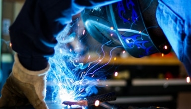man holding gray steel frame