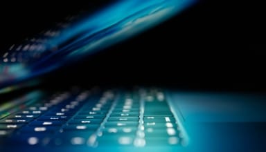 closeup photo of turned-on blue and white laptop computer