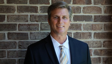 portrait photography of man wearing black suit jacket