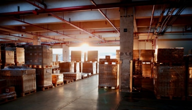 Warehouse storage filled with pallets of goods.